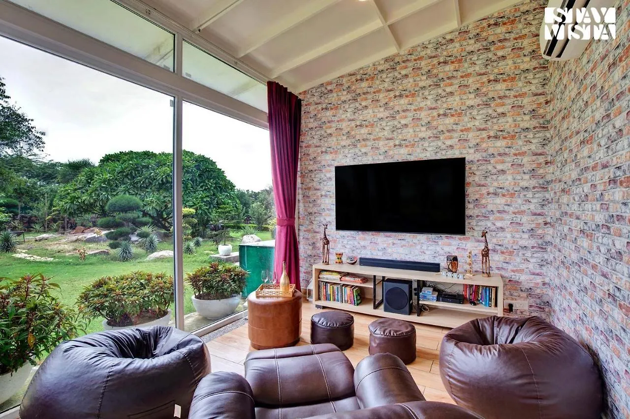 Stayvista's Glasshouse: Orchard Farmstay with Pool and Relaxation Gurgaon Villa