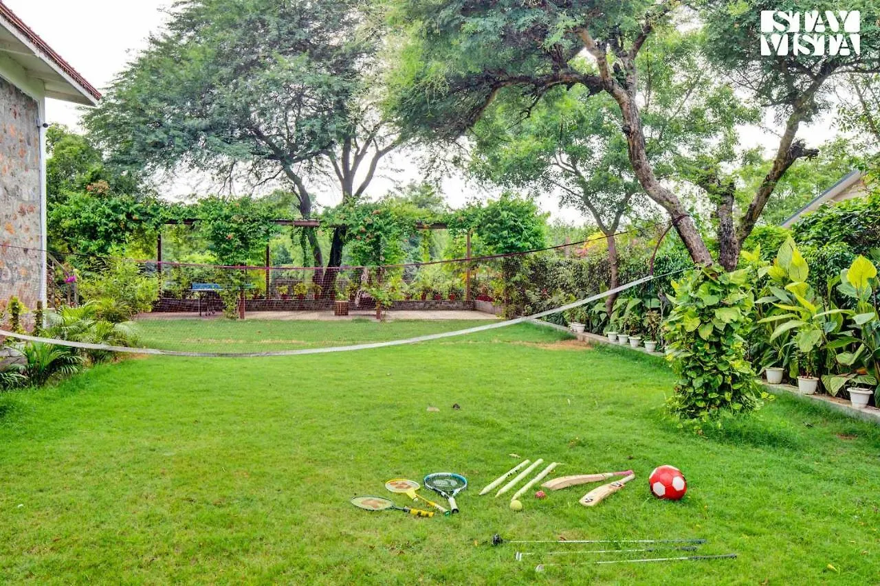 Stayvista's Glasshouse: Orchard Farmstay with Pool and Relaxation Gurgaon India