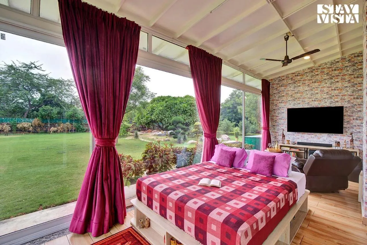 Stayvista's Glasshouse: Orchard Farmstay with Pool and Relaxation Gurgaon Villa